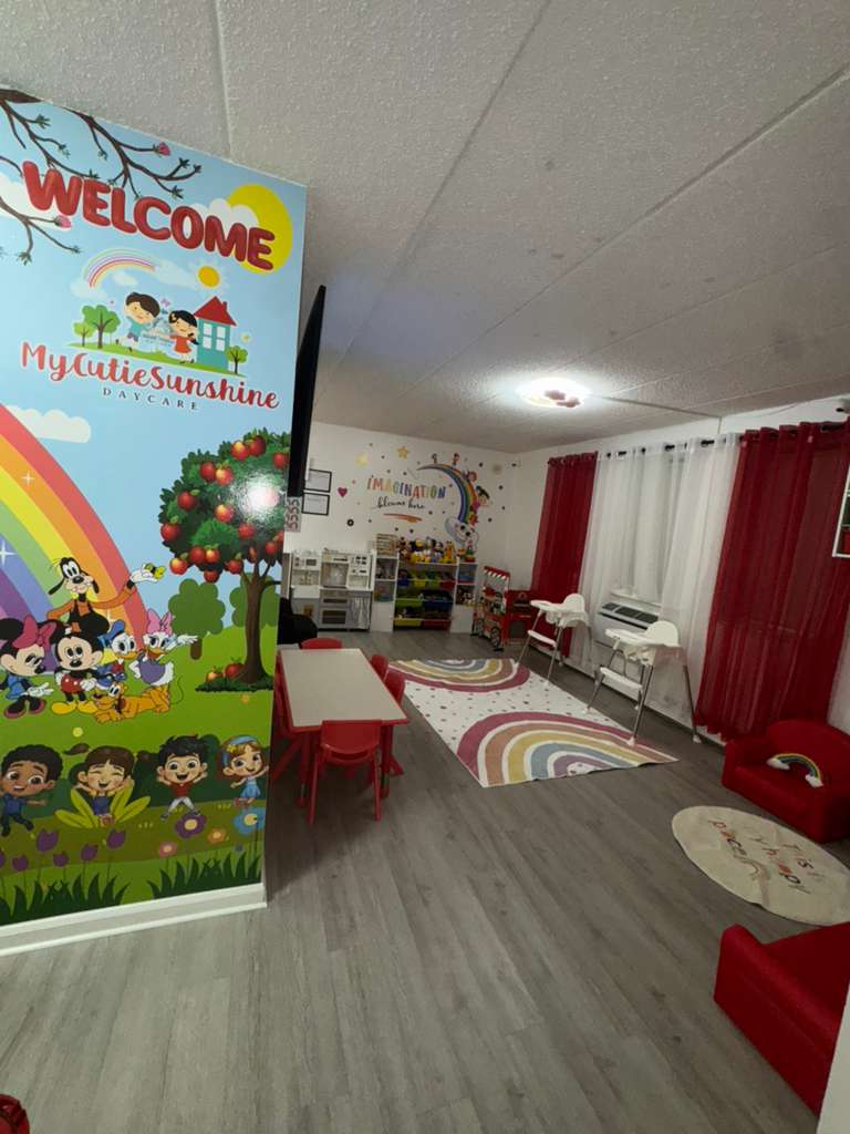 Main play area with rainbow rugs and organized toy storage